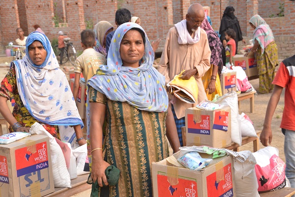 Village women with food aid package