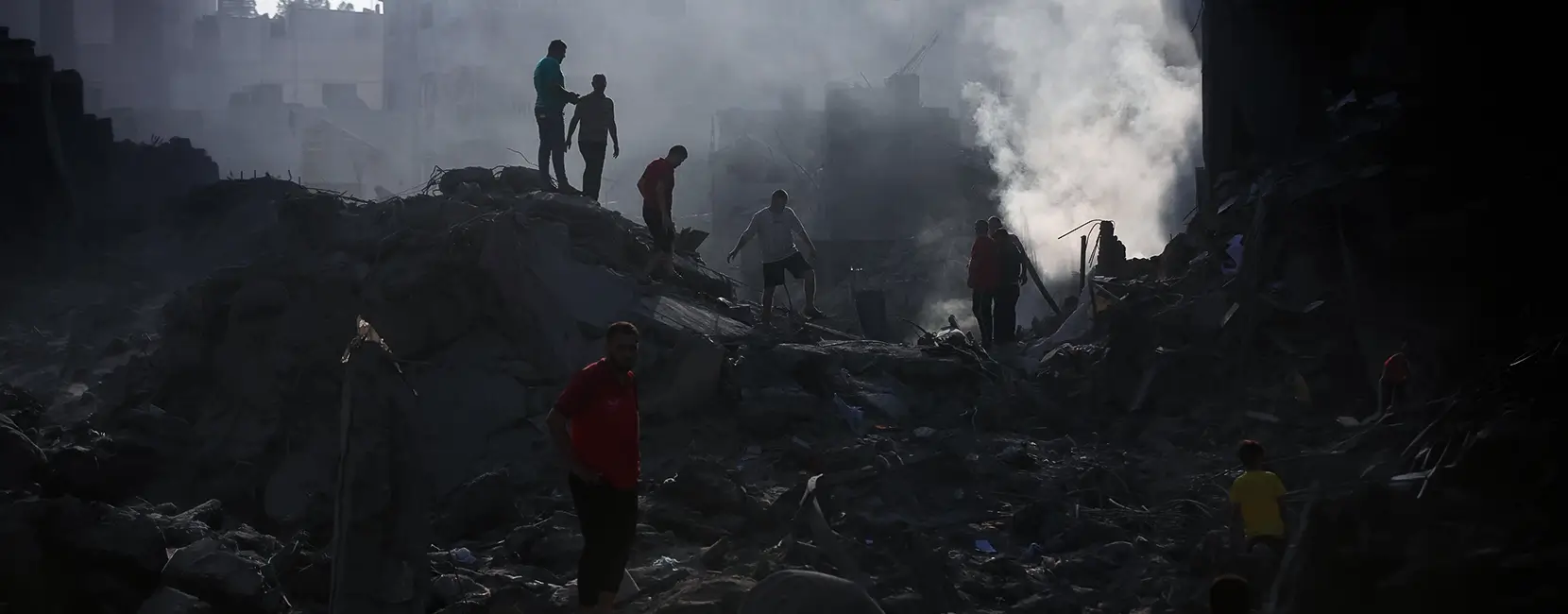 A group of people helping to put out a fire in Gaza